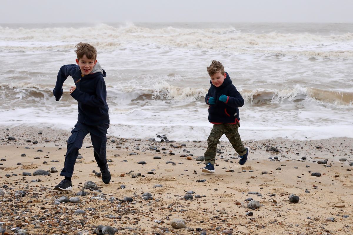 Children running on beach